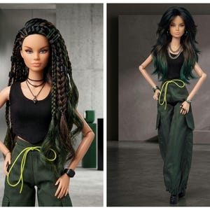 May include: A fashion doll with long dark hair featuring braids and green highlights, wearing a black sleeveless top, dark green cargo pants with a bright neon yellow drawstring, a layered necklace, and a black wrist accessory on one arm.