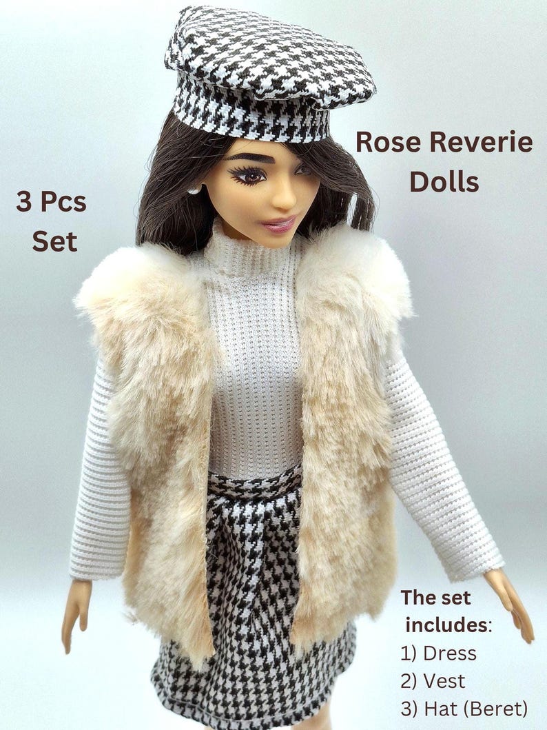 May include: A doll wearing a white sweater, a faux fur vest, and a black and white houndstooth skirt and beret. The set includes a dress, vest, and hat. The text on the image says "Rose Reverie Dolls" and "3 Pcs Set".