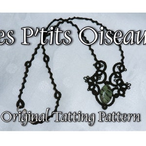 May include: A black tatting necklace with a green stone pendant. The necklace is labeled "Les P'tits Oiseaux Original Tatting Pattern".