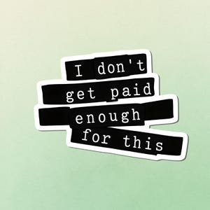 May include: A sticker with the text "I don't get paid enough for this" in a black, bold font on a white background. The sticker is layered on a light green background.