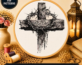 Puede incluir: Un patrón de punto de cruz en un bastidor de madera con un diseño en blanco y negro de una cruz de madera con una corona de espinas. El texto INSTANT PDF PATTERNS y BUY 1 GET 1 FREE BONUS PATTERN es visible en la imagen.