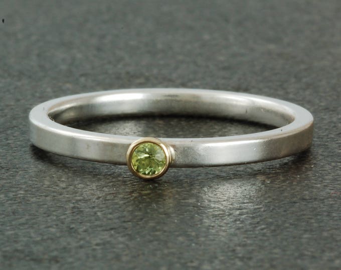 August birthstone ring, natural peridot. Sterling silver ring available with white or yellow gold bezel; stacking