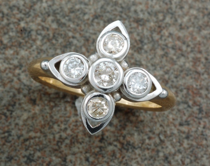Unique diamond ring!  Low profile yet engaging and easy to wear!