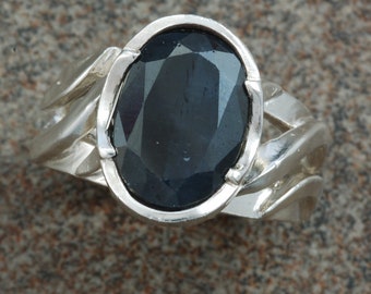 Sterling silver "twist" ring set with oval black sapphire.