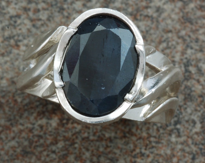 Sterling silver "twist" ring set with oval black sapphire.