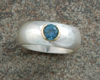 Sterling silver and gold ring set with Montana sapphire.