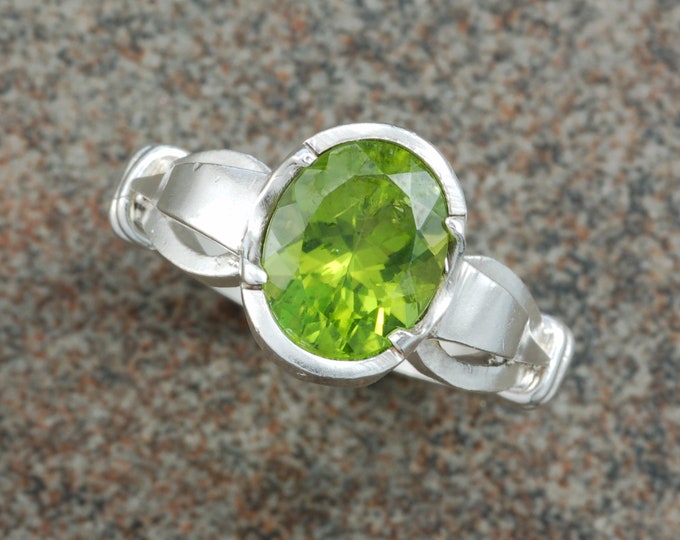 Sterling silver "shepherds hook" ring set with peridot.