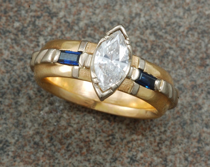 Marquise diamond and sapphire engagement ring in white and yellow gold