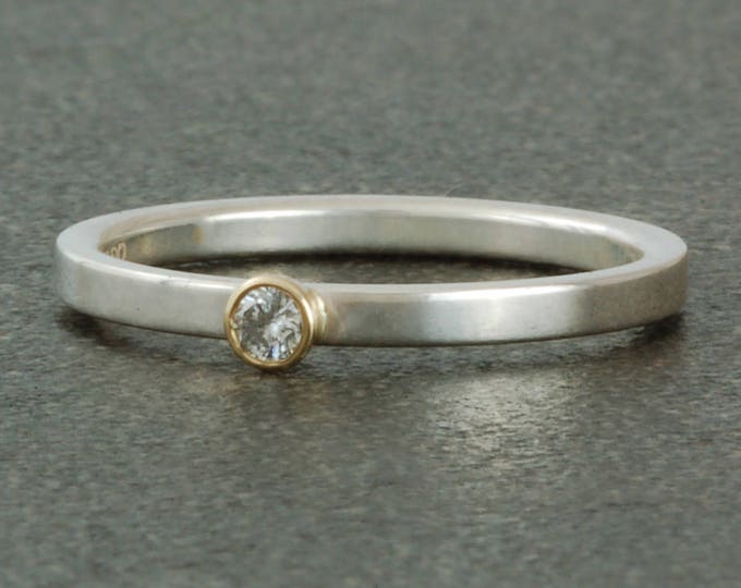 April birthstone ring, diamond. Sterling silver ring available with yellow or white gold bezel, stacking.