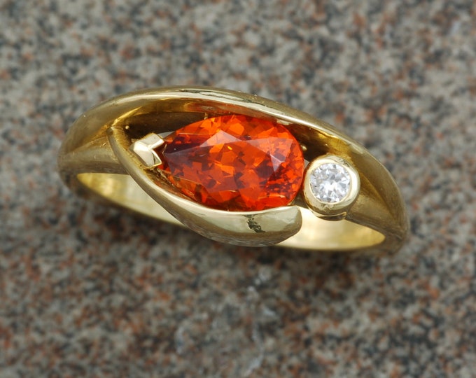 Spessertite Garnet set in 18 karat yellow gold contemporary ring