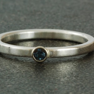 December birthstone ring, natural blue Zircon.  Sterling silver ring available with white or yellow gold bezel, stacking.