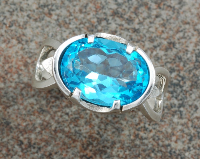 Sterling silver showstopper ring with oval Swiss blue topaz.