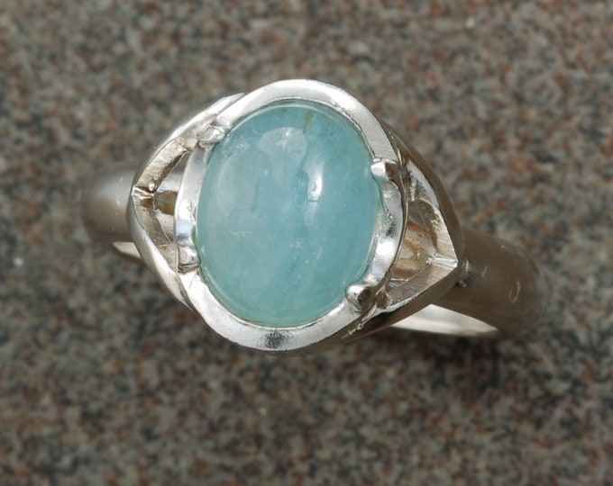 Beryl cabochon set in sterling silver ring.