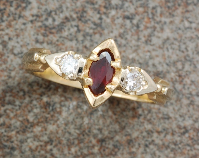 Ruby and diamond ring | 14 karat yellow and white gold | unique |marquise shape