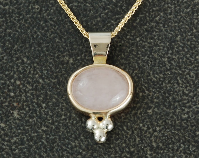 14 karat pendant set with lovely morganite cabochon.