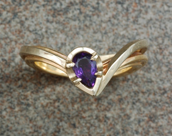 White and yellow gold asymmetrical amethyst ring.