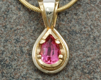 White and yellow gold teardrop pendant with pink tourmaline.