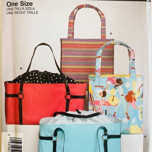 May include: A Simplicity sewing pattern envelope 4909 for tote bags. The cover displays four bag designs: a multi-colored striped tote, a light blue tote with a black drawstring, a red tote with black straps, and a tote with a colorful graphic print.