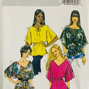 May include: Butterick sewing pattern B5496 for tops in size ZZ (Lrg-Xlg-Xxl). The envelope features illustrations of four variations: a solid yellow top with a tie neck, a floral print top, a paisley print top, and a solid pink top with a V-neck.
