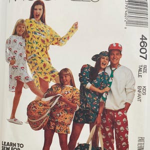 May include: McCall's pattern for kids' sleepwear. The image shows a group of people wearing matching pajamas with festive prints. The pattern includes various sizes and styles, perfect for creating holiday outfits. The text on the pattern reads "Learn to sew for fun."