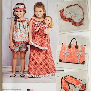 May include: Simplicity sewing pattern 1129 A for children's clothing and accessories, including a floral sleep mask, a plaid nightgown, matching doll clothes, a patterned travel bag, and fabric slippers, with size U.S. 3-8 printed on the envelope.