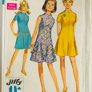 May include: Vintage Simplicity sewing pattern 7554 for junior petite dresses. The illustration shows three mini-length dresses in blue, floral, and yellow. The pattern includes sizes for a 33-inch bust and is marked as easy cut and easy sew.