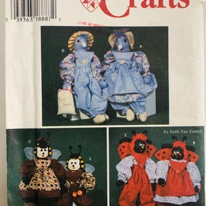 May include: Simplicity Crafts pattern featuring various stuffed animal designs. Includes patterns for bird dolls in overalls, bee dolls, and ladybug dolls. The pattern is one size.