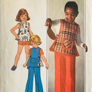 May include: Simplicity sewing pattern 7592, featuring children's clothing designs. The pattern includes illustrations of outfits: a plaid vest and orange pants, a blue jumper with matching pants, and a printed top with orange shorts. The text "SIMPLE-TO-SEW" is at the bottom.