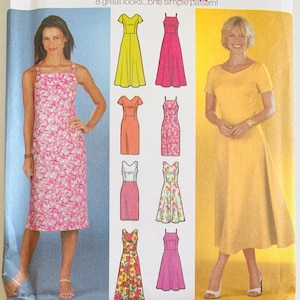 May include: A sewing pattern envelope titled DESIGN YOUR OWN 8 great looks...one simple pattern! featuring illustrations of eight different dress styles, including a pink floral print dress and a solid yellow dress with short sleeves.