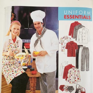 May include: McCall's Uniform Essentials sewing pattern envelope featuring illustrations of chef jackets, pants, aprons, and hats. The cover displays a person wearing a vegetable-print apron and another wearing a white chef coat, hat, and checkered pants.