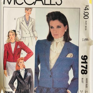 May include: McCall's sewing pattern envelope featuring illustrations of women's blazers and suits. The envelope has the text "McCALL'S" at the top and the pattern number "9178". The image shows a blue blazer and a red blazer.