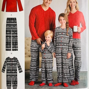 May include: Simplicity pattern 8269 featuring sewing instructions for red V-neck long-sleeve shirts and black and white patterned pajama pants or a button-front jumpsuit. The package displays illustrations of the garments and a family wearing them.