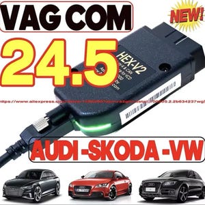 May include: Black HEX-V2 diagnostic tool with the text "VAG COM 24.5" and "AUDI-SKODA-VW". The tool is connected to a cable and has a green light. The image also shows three cars.