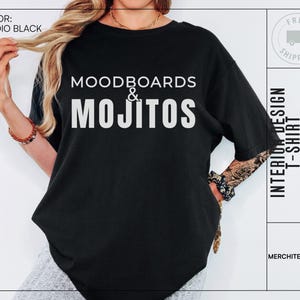 May include: Black t-shirt with white text that reads "Moodboards & Mojitos" and "Interior Design T-Shirt".