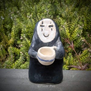 Handmade Ceramic No Face with Coffee Cup