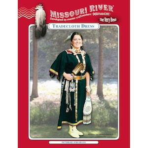 May include: A woman wearing a dark green Tradcloth Dress, adorned with a beaded necklace and belt, holding a fan and a white bag. The dress features yellow and red trim. The image is framed by a red border with the text "MISSOURI RIVER" and "TRADECLOTH DRESS".
