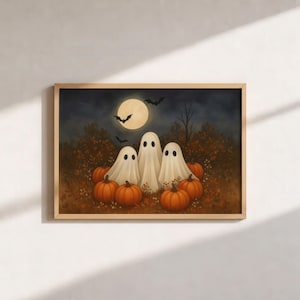 May include: A rectangular framed wall art print featuring three white ghosts standing among orange pumpkins in a dark forest at night. A large yellow full moon hangs in the sky above, with several black bats flying near the trees and foliage.