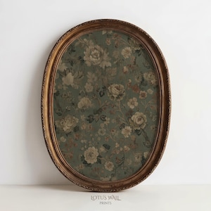 May include: An oval-shaped wall art piece with a gold-colored, ornate frame. The artwork inside features a floral pattern in shades of green, cream, and brown. The text "LOTUS WALL PRINTS" is printed at the bottom.
