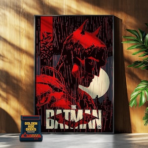 Puede incluir: Un póster rojo y negro con un primer plano de la cara de Batman con lluvia cayendo en el fondo. El texto "The Batman" está en la parte inferior del póster con un logotipo de DC Comics.