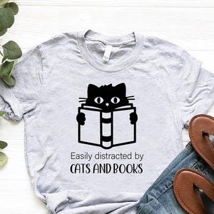 Easily Distracted By Cats And Books Shirt, Funny Bookworm Gift,Librarian Shirt, Reading Tshirt,Book Club Gifts,Funny Cat Shirt,Book Nerd Tee