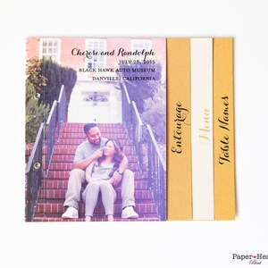May include: Wedding invitation suite with a photo of a couple sitting on a staircase. The invitation includes the couple's names, wedding date, and location. The other cards include the words "Entourage", "Menu", and "Table Names".