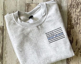 Apoya a nuestra policía // Bandera de la Línea Azul Delgada // Lazos // Sudadera unisex de cuello redondo Heavy Blend™