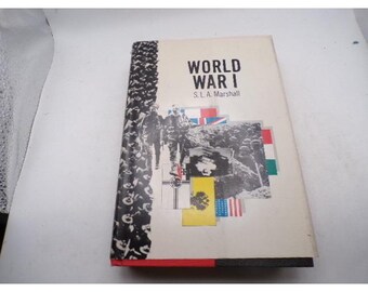 May include: A hardcover book titled "World War I" by S.L.A. Marshall. The cover features a black and white image of soldiers, flags, and other images. The spine has a black and white pattern.