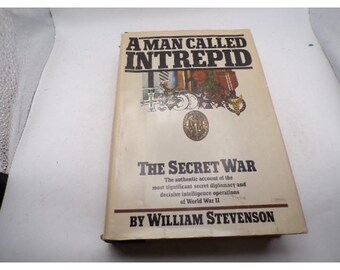 May include: A vintage book titled "A Man Called Intrepid" with the subtitle "The Secret War." The cover features illustrations and text, including the author's name, William Stevenson. The book details secret diplomacy and intelligence operations of World War II.