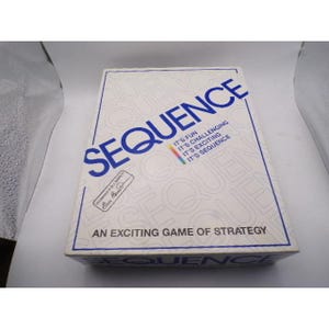 May include: A white box for the game "Sequence" with blue text. The box reads "Sequence" in large letters, with smaller text below that says "It's Fun, It's Challenging, It's Exciting, It's Sequence". The bottom of the box reads "An Exciting Game of Strategy".