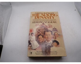May include: A paperback book titled "The Soong Dynasty" by Sterling Seagrave. The cover features a collage of images, including portraits of people, a dragon, and a pagoda. The book is a national bestseller.