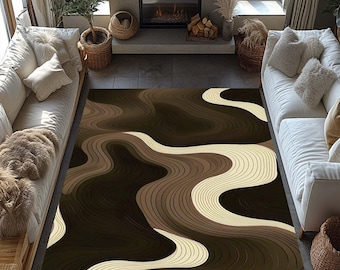May include: A large area rug with a flowing, layered design in shades of brown and cream. The rug's pattern resembles topographical lines, creating a sense of depth and movement. The rug is placed in a living room setting with white sofas and a fireplace.