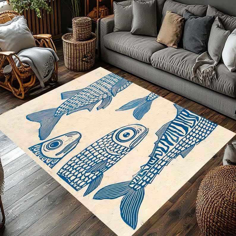 May include: A rectangular area rug with a cream-colored background features a repeating pattern of blue fish illustrations. The fish vary in size and orientation, creating a dynamic and artistic design. This rug is suitable for living rooms and bedrooms.
