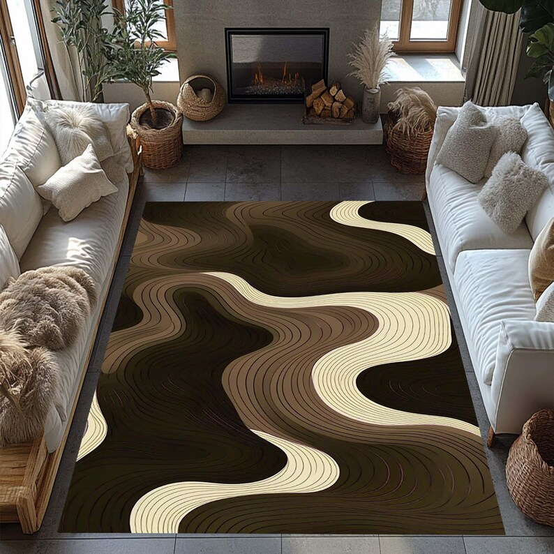 May include: A large area rug with a flowing, layered design in shades of brown and cream. The rug's pattern resembles topographical lines, creating a sense of depth and movement. The rug is placed in a living room setting with white sofas.