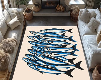 May include: A rectangular area rug featuring a stylized illustration of sardines. The design showcases a school of blue and black fish against a beige background. The word "SARDINES" is printed in black at the bottom.